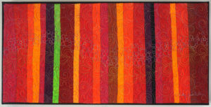Aurora Art Quilt in warm reds -Cindy Grisdela